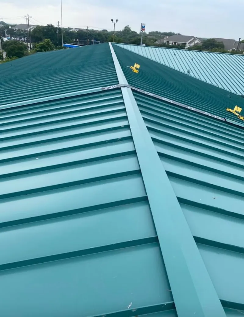 Green commercial metal roof ridge and valley for Metal Roof Repair in Griswold