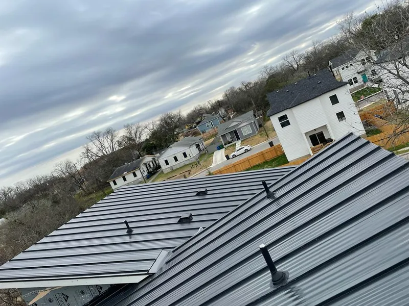 Standing seam metal roof panels with vents for Skylight Repair in Griswold